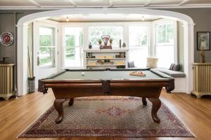 a living room with a pool table in it at Granville House in Great Barrington