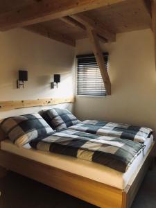 a bedroom with a bed in a room at Kameňácká myslivna in Moravany