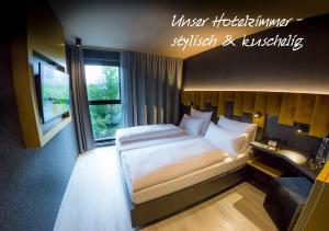 Postel nebo postele na pokoji v ubytování MY HOME MY HOTEL Rosenheim