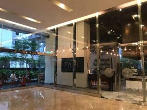 a lobby of a building with a glass wall at KLCC Apartment in Kuala Lumpur +48 photos