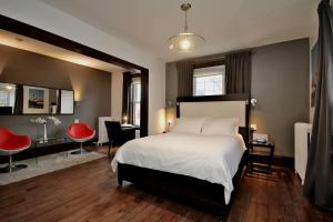 Postel nebo postele na pokoji v ubytování Swiss Hotel