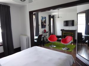Postel nebo postele na pokoji v ubytování Swiss Hotel