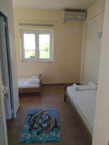 A bed or beds in a room at Neohori 3