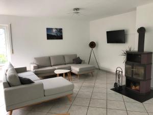 a living room with a couch and a fire place at Ferienwohnung Zenzen in Cochem