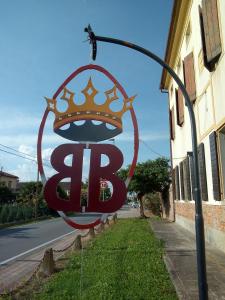 a large sign with a crown on top of it at LA GASTALDIA in Pontecasale