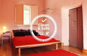 a sign that says clean and safe in a room at Casa Ana Monteiro in Vila Nova de Famalicão