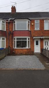 a brick house with a driveway in front of it at Beverley East Townhouse Free Parking in Beverley