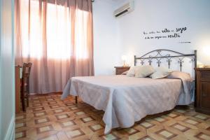 Postel nebo postele na pokoji v ubytování Poesia del Mare B&B