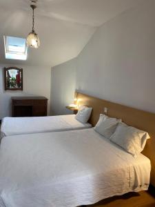 Ένα ή περισσότερα κρεβάτια σε δωμάτιο στο Guesthouse Lusa Atenas