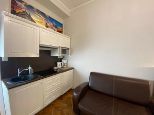Kuchyňa alebo kuchynka v ubytovaní P&J Apartamenty Św. Krzyża