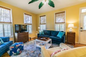 a living room with blue couches and a tv at 1200 London Ave Port Royal, SC 29935 in Port Royal