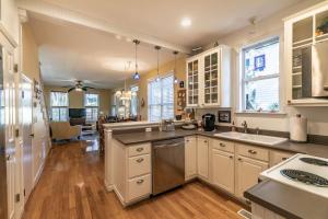 a kitchen with white cabinets and a counter top at 1200 London Ave Port Royal, SC 29935 in Port Royal