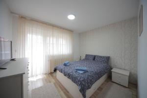Postel nebo postele na pokoji v ubytování Apartman DIAMOND-LUX