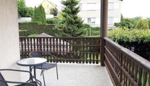 a patio with a table and chairs on a balcony at Penzion Bezděkov in Rakovník