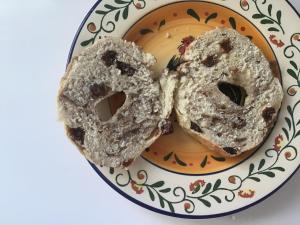 two donuts are sitting on a plate at Beautiful Room near JFK and close to LaGuardia Airports in Laurelton