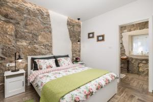 Postel nebo postele na pokoji v ubytování Villa Aurania