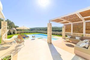 an image of a backyard with a swimming pool at Blue Lake Villa Heated Pool in Georgioupoli