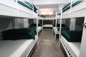 A bed or beds in a room at Madrid Downtown Hostel