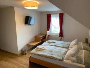 Un pat sau paturi într-o cameră la Guesthouse Veranda