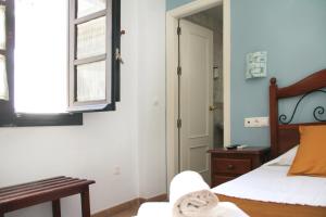 Postel nebo postele na pokoji v ubytování La Piquera Hostal
