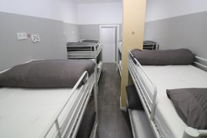 A bed or beds in a room at Madrid Downtown Hostel