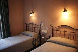 Posteľ alebo postele v izbe v ubytovaní Hotel Peninsular