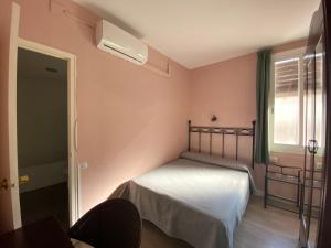 Posteľ alebo postele v izbe v ubytovaní Hotel Peninsular