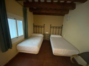 Posteľ alebo postele v izbe v ubytovaní Hotel Peninsular