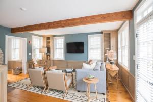 a living room with a couch and chairs at The Bungalow in Nantucket