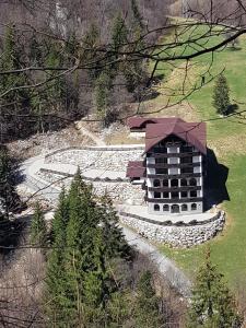 an aerial view of a building in a field at Vila Vraja Muntelui in Moieciu de Jos +13 photos