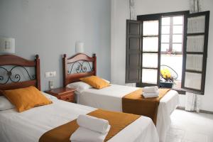Postel nebo postele na pokoji v ubytování La Piquera Hostal