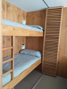 a couple of bunk beds in a room at Achillea Alpina Cervinia apartment Vda Vacanze in Vetta CIR 0249 in Breuil-Cervinia