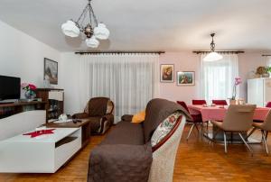 a living room with a couch and a table at Apartment Vinez in Labin