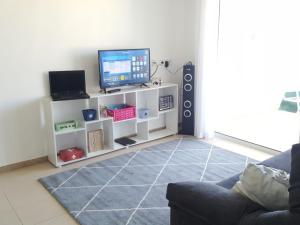 A television and/or entertainment centre at BRAVAHOLIDAYS-260-Lotus-2