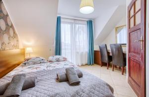 Postel nebo postele na pokoji v ubytování Willa Olivia