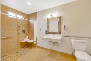 a bathroom with a toilet and a sink and a shower at Hotel 414 Anaheim in Anaheim