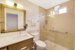 a bathroom with a toilet and a sink and a shower at Hotel 414 Anaheim in Anaheim