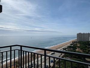 a view of the beach from the balcony of a condo at Apartamento primera línea de Mar Enjoy the view in Blanes