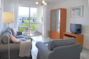 a living room with two couches and a television at Great 2 Bedroom Apartment Near Puerto Banus in Marbella