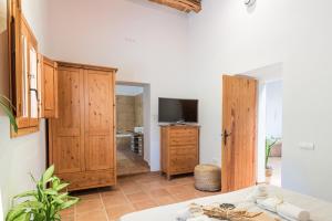 TV a/nebo společenská místnost v ubytování Casa rural es Murtà