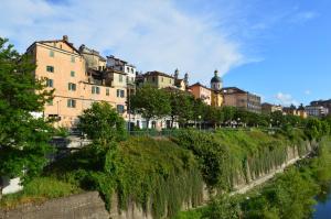 a row of buildings on the side of a river at Sweet Home Sara in Ovada