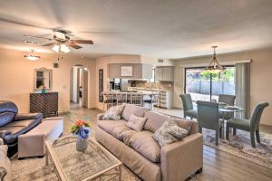 a living room with a couch and a table at Lake Havasu City Home with Views 3 Mi to Marina! in Lake Havasu City