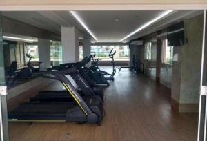 a gym with several treadmills and cardio machines at Salinas Parks in Salinópolis
