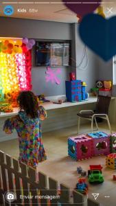 a young child playing in a room with toys at Salinas Parks in Salinópolis