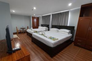 Кровать или кровати в номере One Averee Bay Hotel