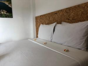 Postel nebo postele na pokoji v ubytování Baan Anattaya Koh yao noi