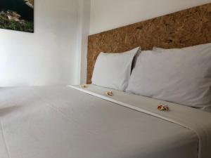 Postel nebo postele na pokoji v ubytování Baan Anattaya Koh yao noi