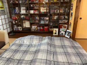 a bed sitting on the floor in a room at Free parking Bito L'histoire hotel #LW178 in Tuyama