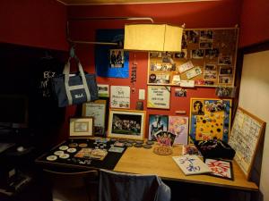 a desk with a bunch of pictures on a wall at Free parking Bito L'histoire hotel #LW178 in Tuyama +20 photos