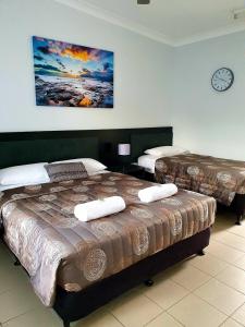 Voodi või voodid majutusasutuse Sunseeker Motel toas